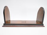 a close up of a wooden shelf with a mirror on it