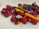 a lot of toy firetrucks that are on the table