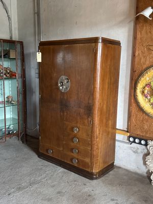 a wooden cabinet and a glass cabinet in a room