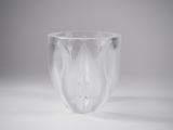 a clear glass cup that is sitting on a table