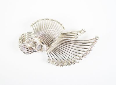 silver plated brooch with pearls on a white background
