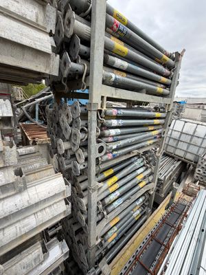 a large pile of steel pipes stacked on top of each other