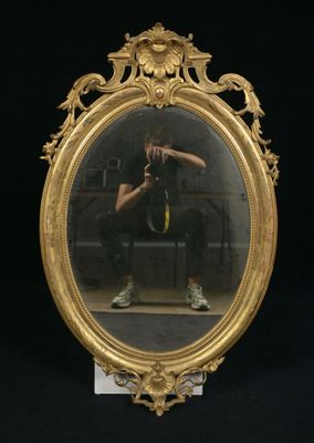 a man taking a picture of himself in a mirror