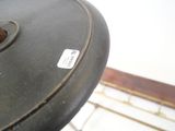 a close up of a black table with a sticker on it