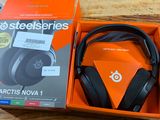 an orange box with a pair of headphones in it on a wooden table
