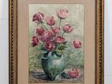 painting of pink roses in a green vase in a gold frame