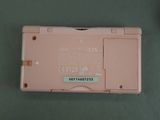 a pink nintendo ds game console sitting on a table