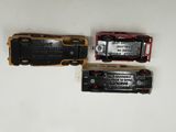 two toy trains sitting on top of a white table next to each other