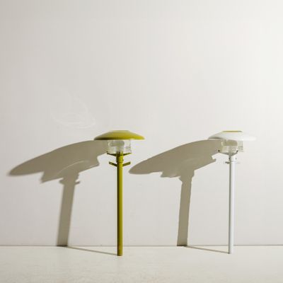 two lamps that are sitting on a white table