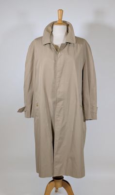 an image of a beige trench coat on a mannequin stand