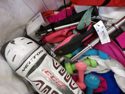 a bag full of ski gear and skis and ski poles