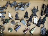 many figurines that are in a box on the table