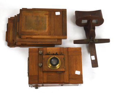 three wooden cameras are sitting next to each other on a white surface
