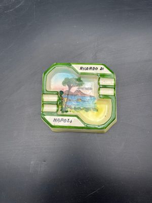 a small plastic container with a picture of a man on it