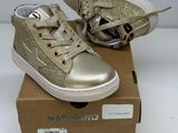 girls ' s gold glittered sneakers in a box on a white surface