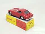 a red toy car sitting on top of a box