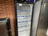 a refrigerator that has a sign on the front of it