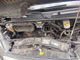 a picture of a car engine with its hood open