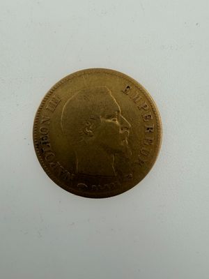an image of a gold coin with a man ' s face on it