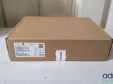 an open box on a table with a sticker on it