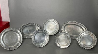 six silverplated trays on a table with a red box