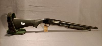 an old shotgun with a wooden stand on a white background