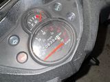 a close up of a motorcycle with a speedometer on it
