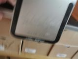 a rear view mirror that is hanging on a shelf