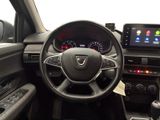 the interior of a car with a steering wheel and dashboard controls