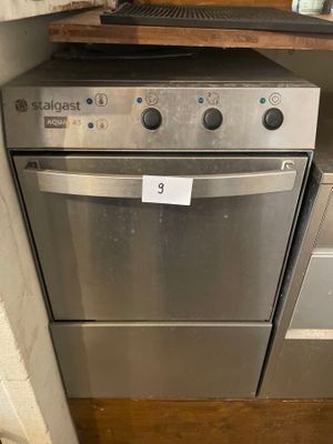 stainless steel dishwasher and oven in a kitchen with wood flooring