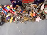 a pile of assorted keychains on a table