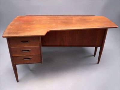 a wooden desk with three drawers and a drawer underneath it