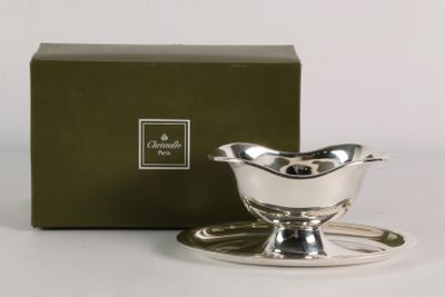 a silver plate with a saucer and saucer on it