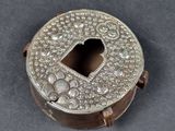 a close up of a metal box with a heart shaped hole in it