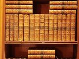 many old books on the shelves in the room