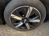 a close up of a tire on the side of a car