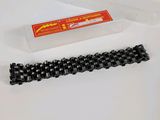 a close up of a chain and a plastic container on a table