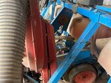 a blue machine that is sitting on the ground