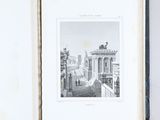 an open book with a black and white photo of a building