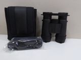 an image of a pair of binoculars sitting on top of a table