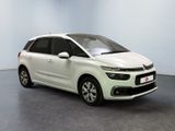 the white citrole is parked in a room with a gray floor