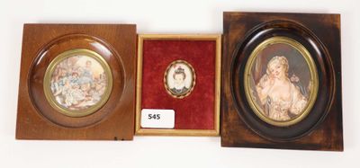 two framed pictures of a woman and a child in a wooden box