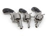 three old revolvers on a white background with a black handle