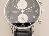 a close up of a wrist watch with a black leather strap