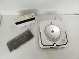 a white box with a cleaning brush and a cleaning cloth