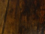 a close up picture of a wooden table with a clock on it