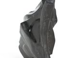 black marble sculpture of a woman ' s head on a white background