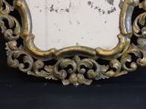 a mirror that is sitting on a black table