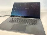 dell laptops are sitting on a table next to each other