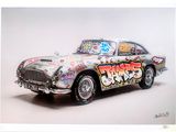 painting of a car with graffiti on the side of it